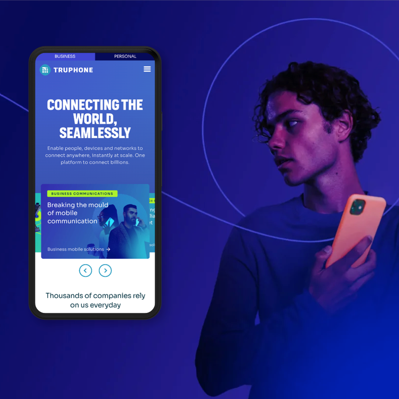 a man holding a cell phone in front of his face